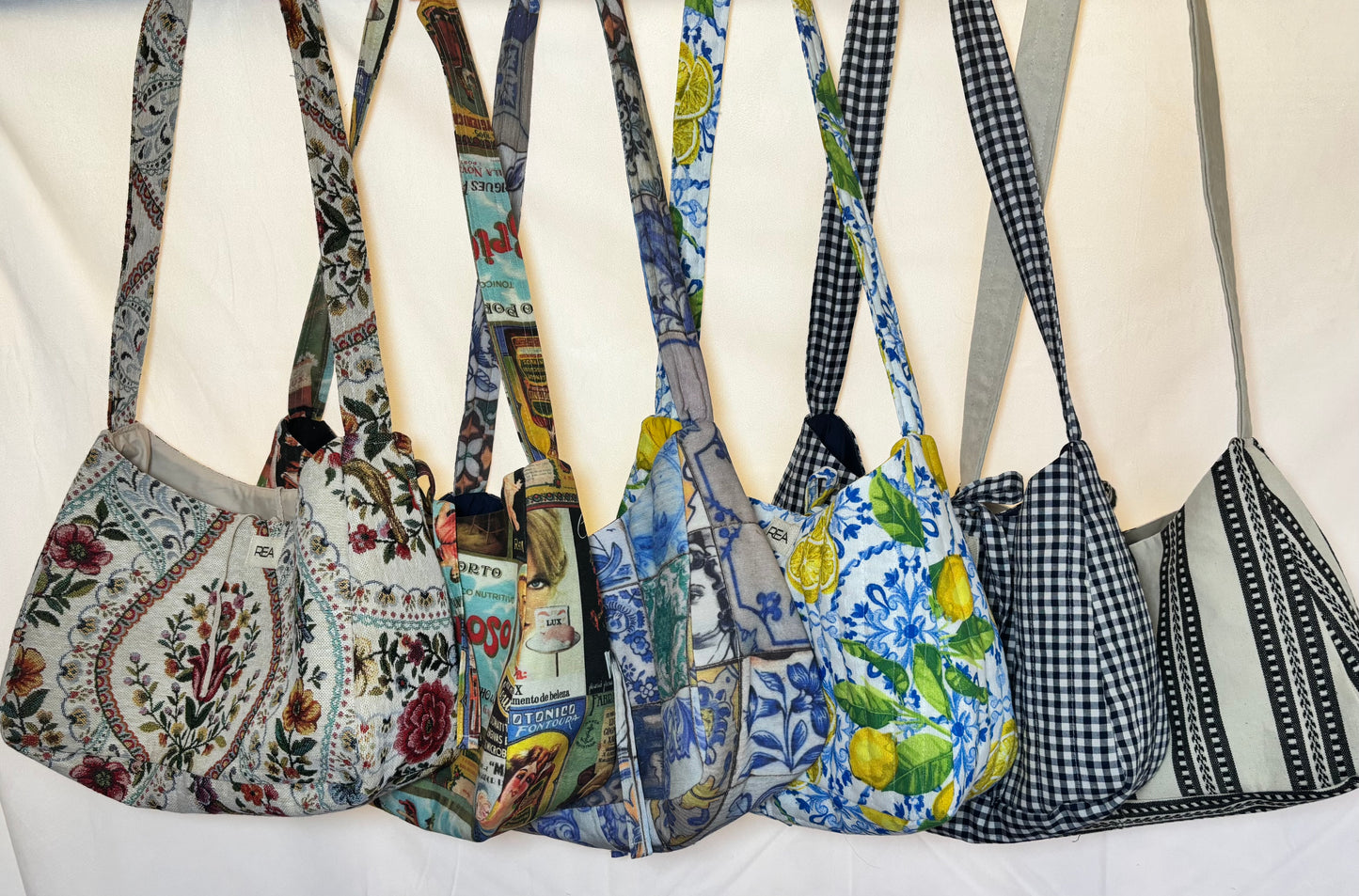 Bow bag with a bow closure and long shoulder strap